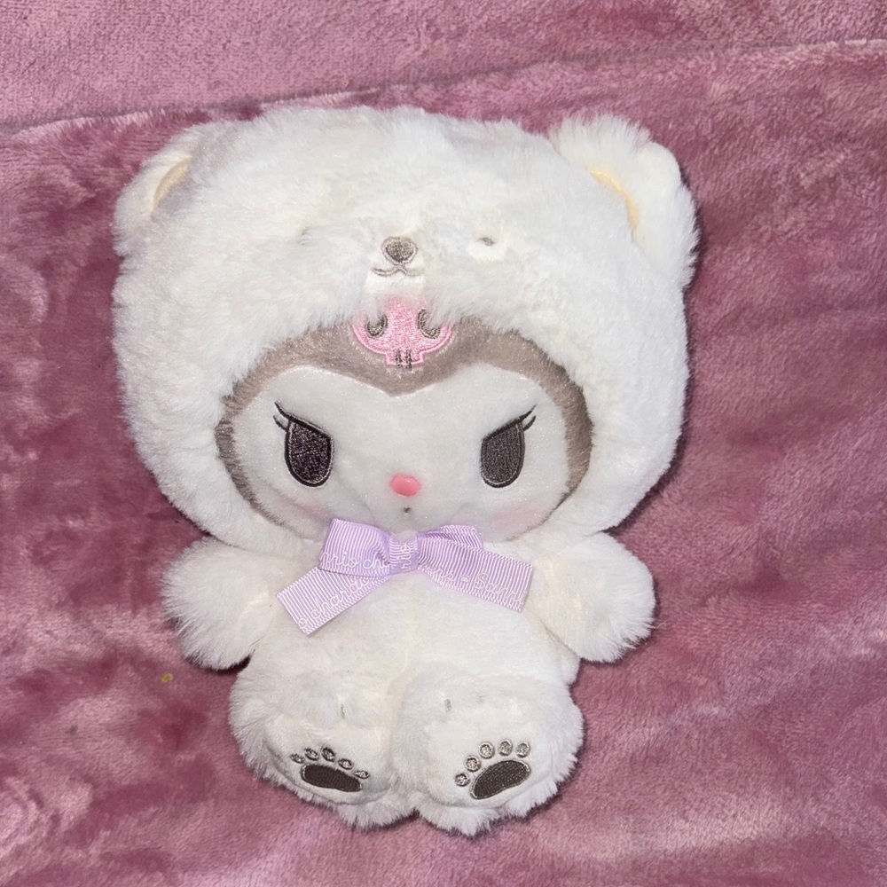 Kuromi dressed as a polar bear plush